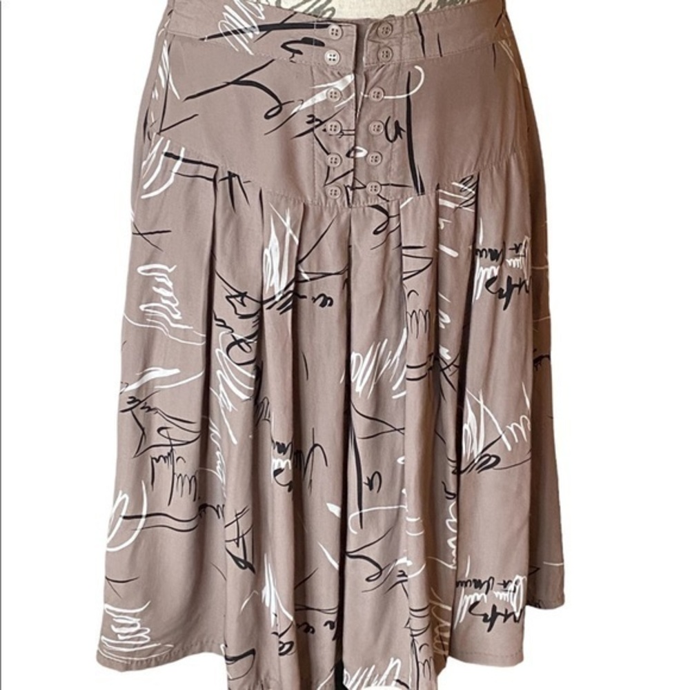 A-Line Soft Pleats Skirt Buttons at the waist.